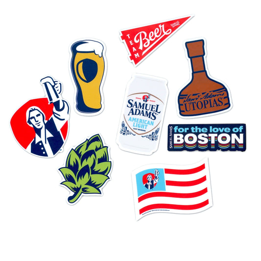 An 8 piece Samuel Adams sticker pack featuring one sticker of each of the following: Sam Adams Utopias bottle, Samuel Adams American Light Can, An American Light Flag, Sam Hoist Logo, Team Beer Pennant, A Pint Full of beer, The Hop, For the Love of Boston
