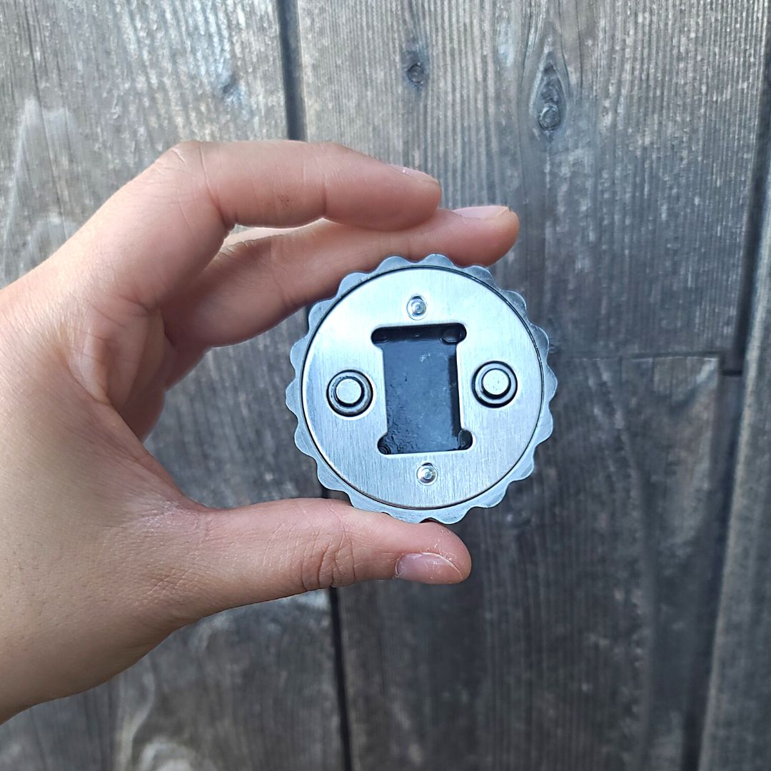 Back of the bottle cap magnet, which also has a bottle opener built in.