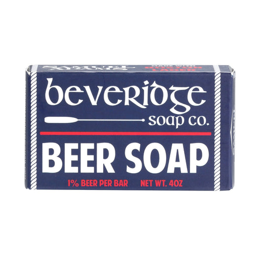 Our Beer soap made with Samuel Adams Boston Lager has a clean men's cologne scent. The soap is packaged in a navy blue box with white text and white and red details.