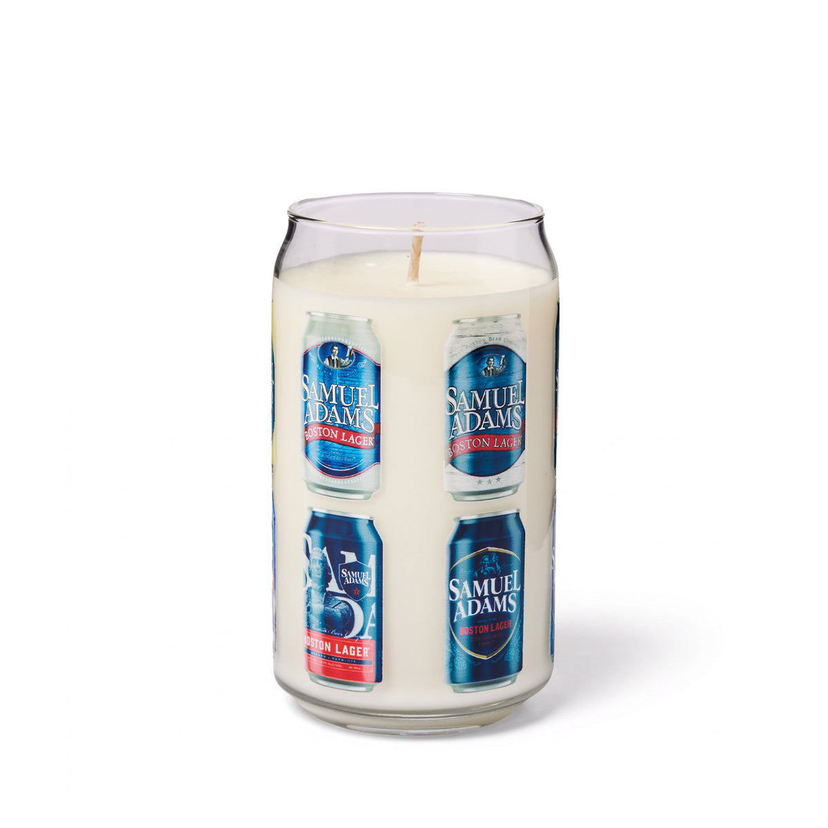 A novelty candle in a clear glass shaped like  Samuel Adams beer can, filled with white wax and featuring printed labels of  Samuel Adams Boston Lager craft beers cans around the circumference of the glass. Set on a white background