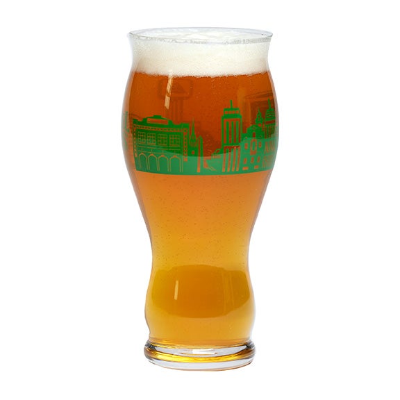 Pint glass with green skyline of boston wrapping around the glass and a matching Samuel Adams logo