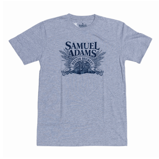 Front of tee features the Samuel Adams logo in blue and artwork of the Boston brewery underneath.