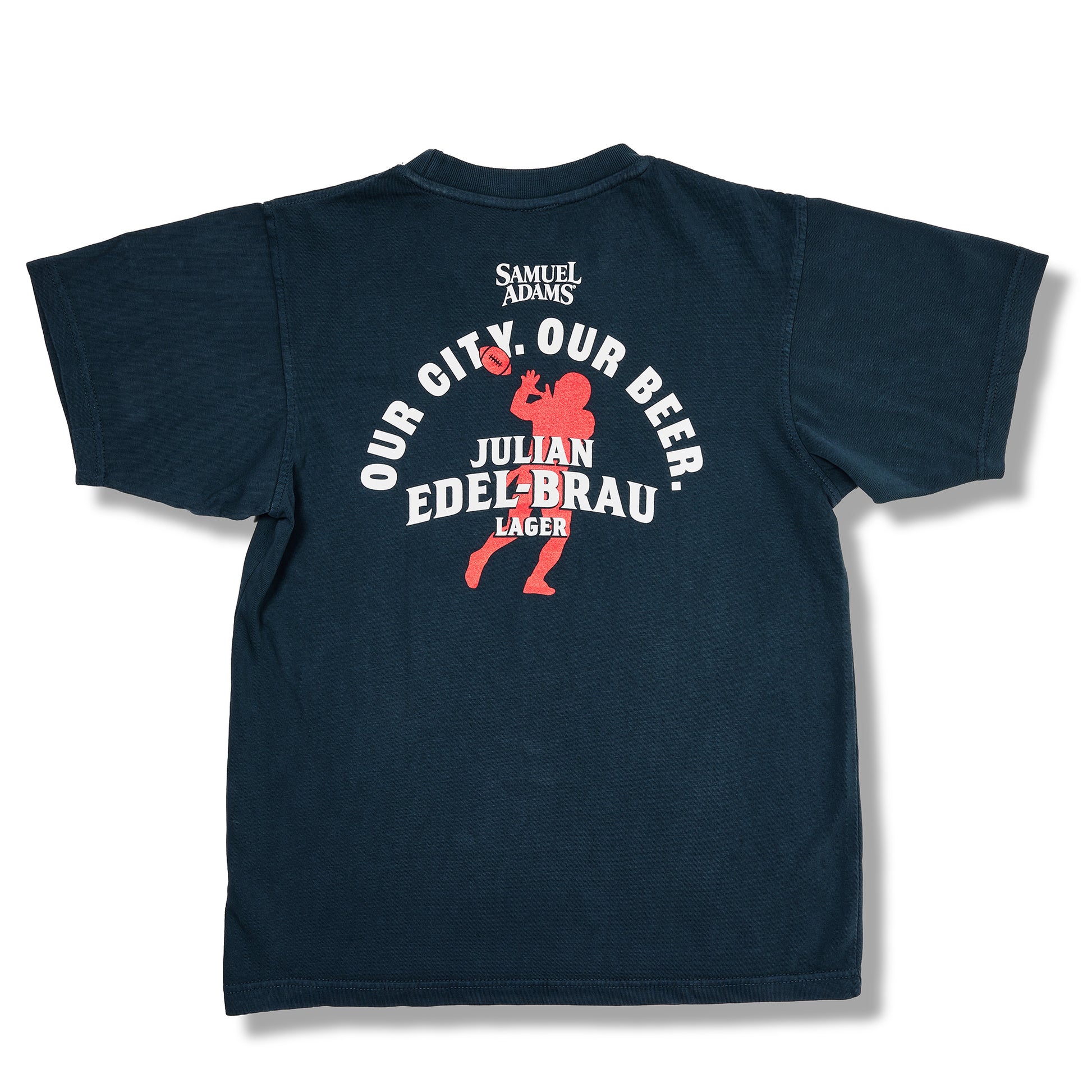 A dark navy blue t-shirt shown from the back, featuring a red and white graphic print with the text 'SAMUEL ADAMS', 'OUR CITY. OUR BEER.