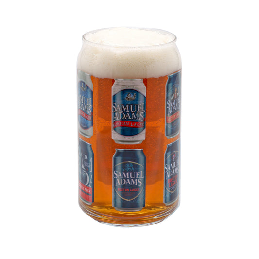 A clear glass printed with a repeating Samuel Adams Boston Lager can design, filled with amber beer and topped with white foam, isolated on a white background.