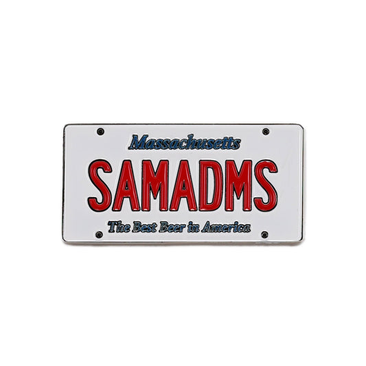 Enamel magnet designed like a Massachusetts license plate with “SAMADMS” in red lettering and “The Best Beer in America” in blue text underneath.