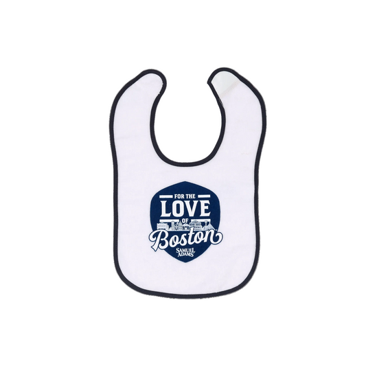This white bib with navy blue trip has velcro for attachment and the Sam Adams "For the love of Boston" design on the front.