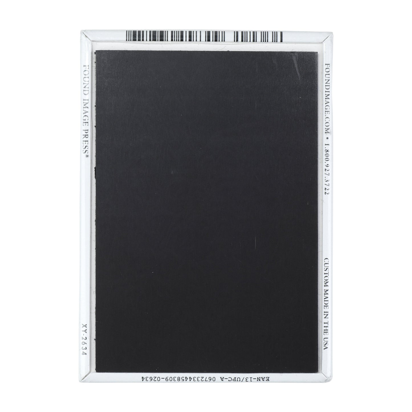 The back features a regular black magnet.