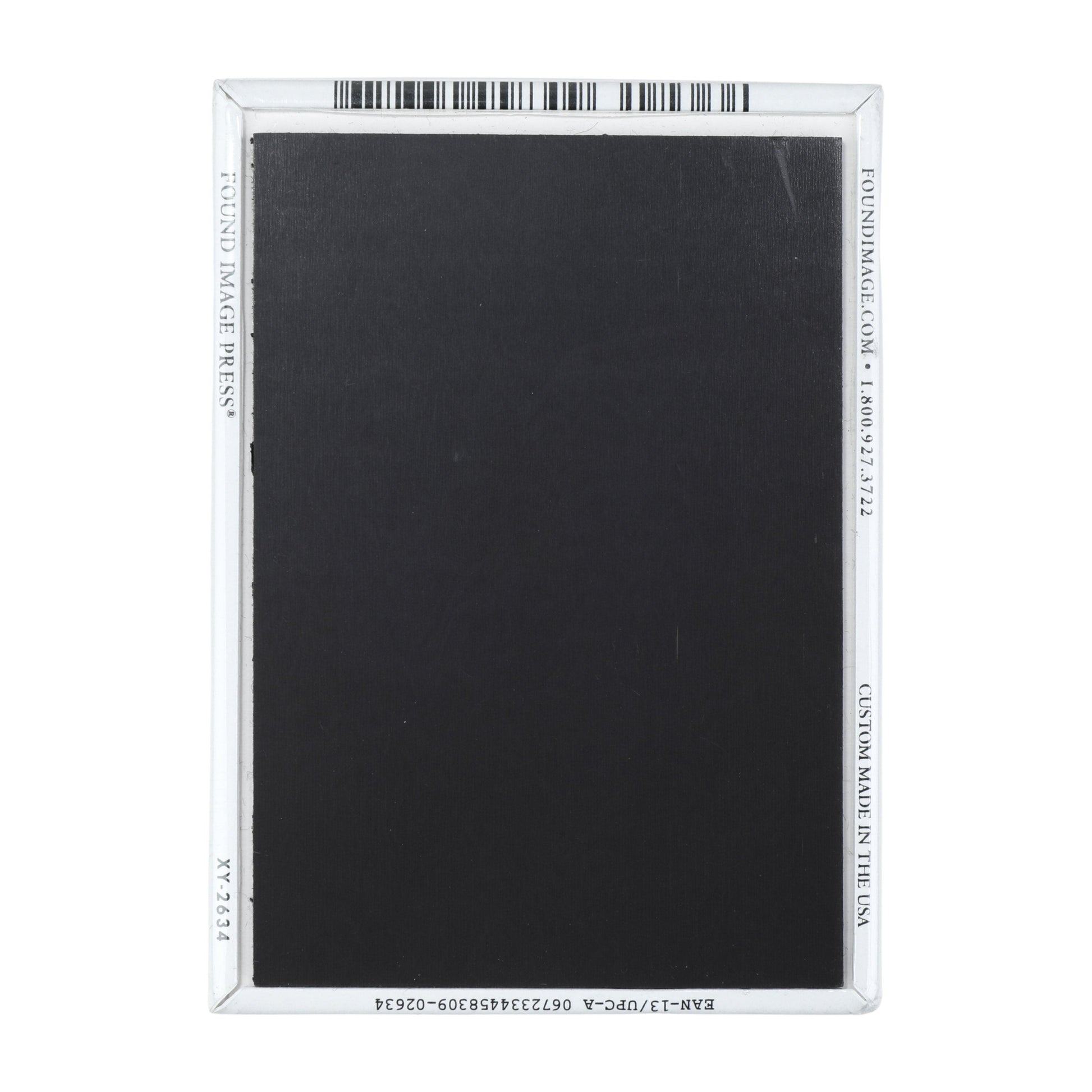 The back features a regular black magnet.