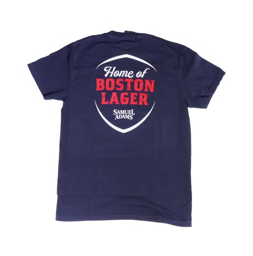 Backside of navy shirt with a large Home of Boston Lager Samuel Adams shield shaped logo. Design is in white text with "Boston Lager" in red.