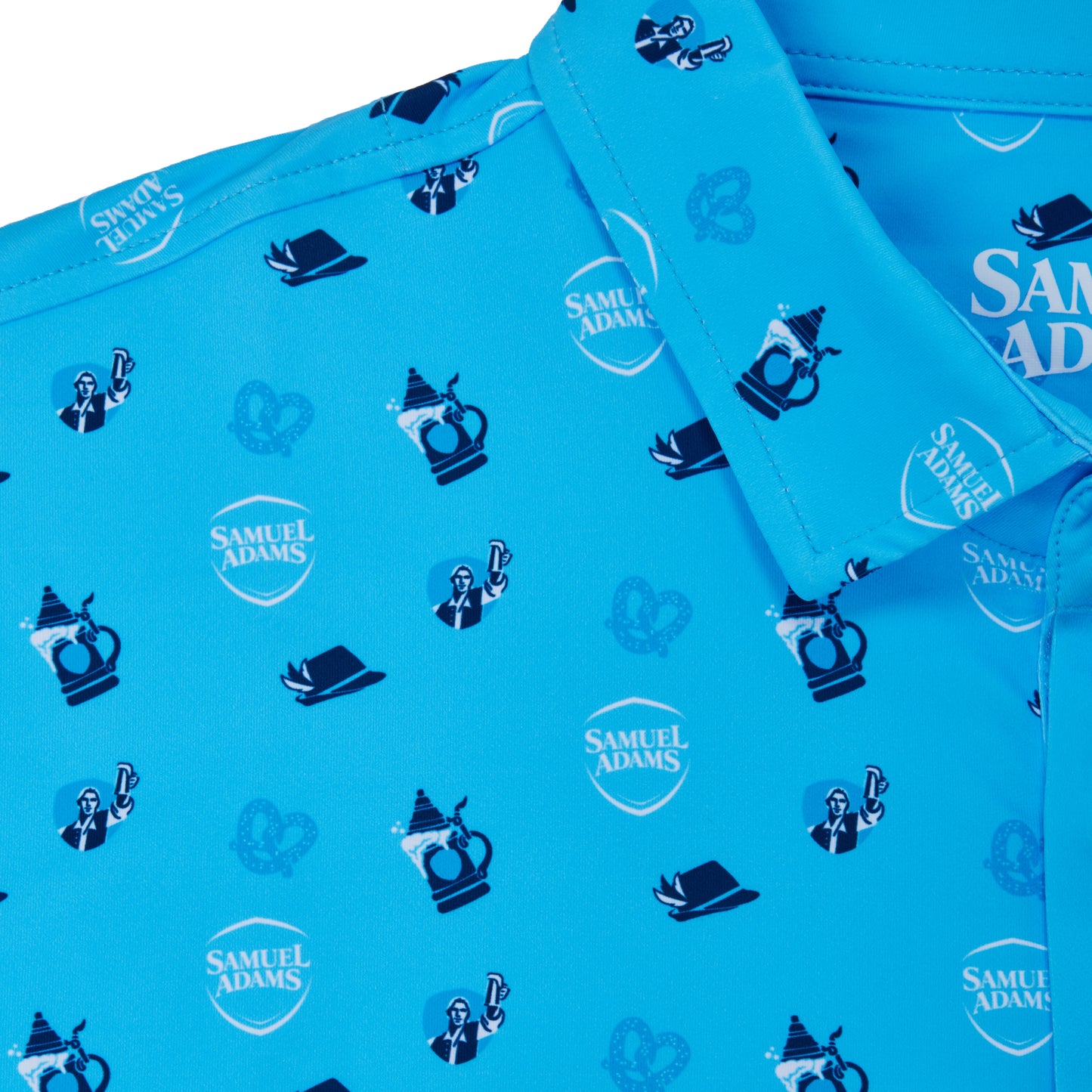 A close-up of a bright blue collared shirt with an all-over Samuel Adams logo print, featuring beer mugs, top hats, and shield logos.