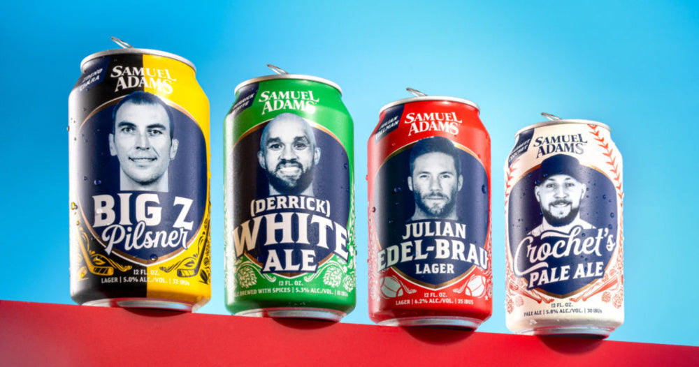 Four Samuel Adams beer cans with different flavors on a red and blue background