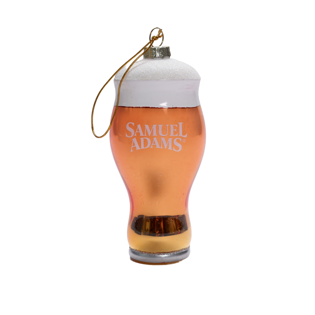 A glass ornament modeled after a perfect pint glass full of Sam Adams beer.