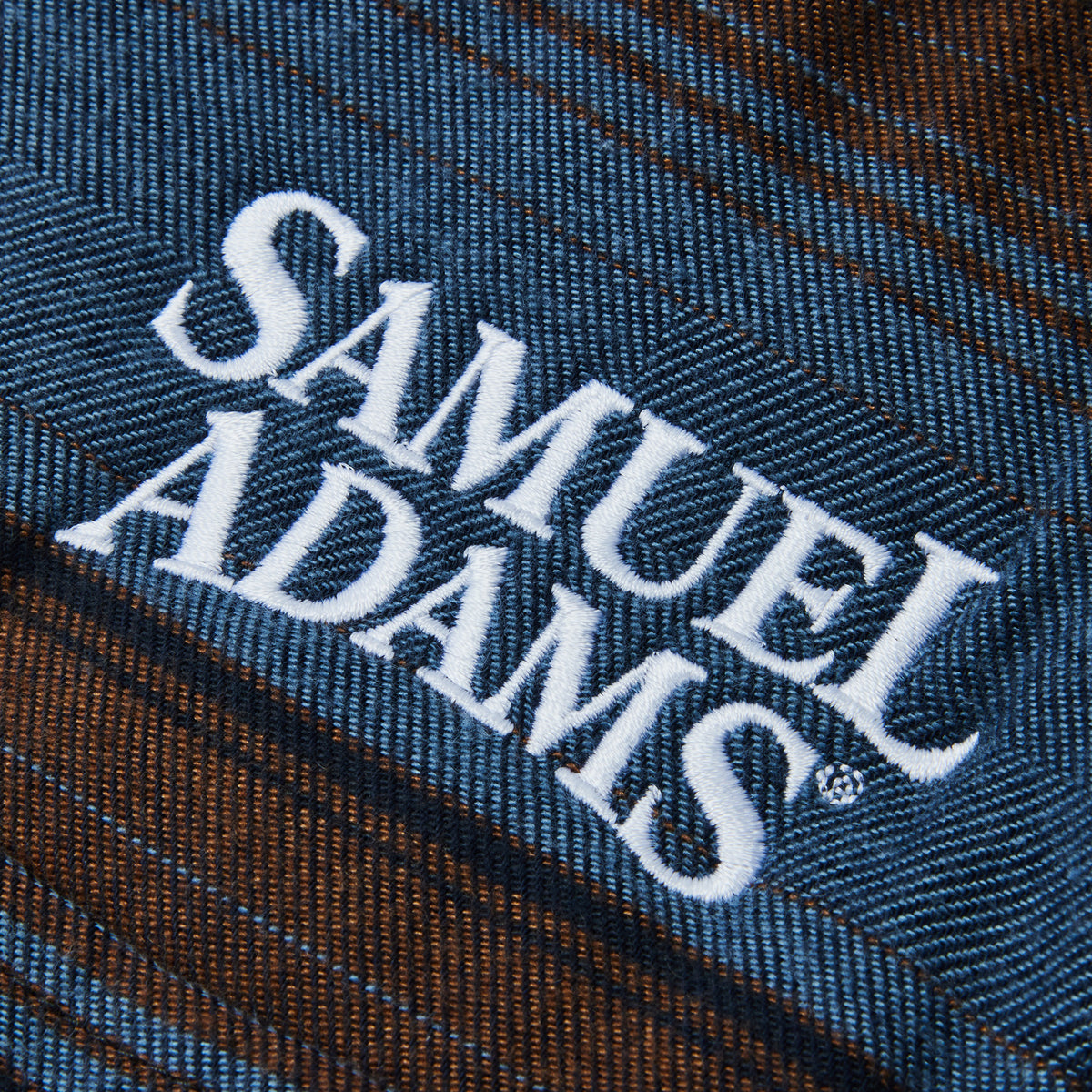 'samuel adams' embroidered on blue shirt