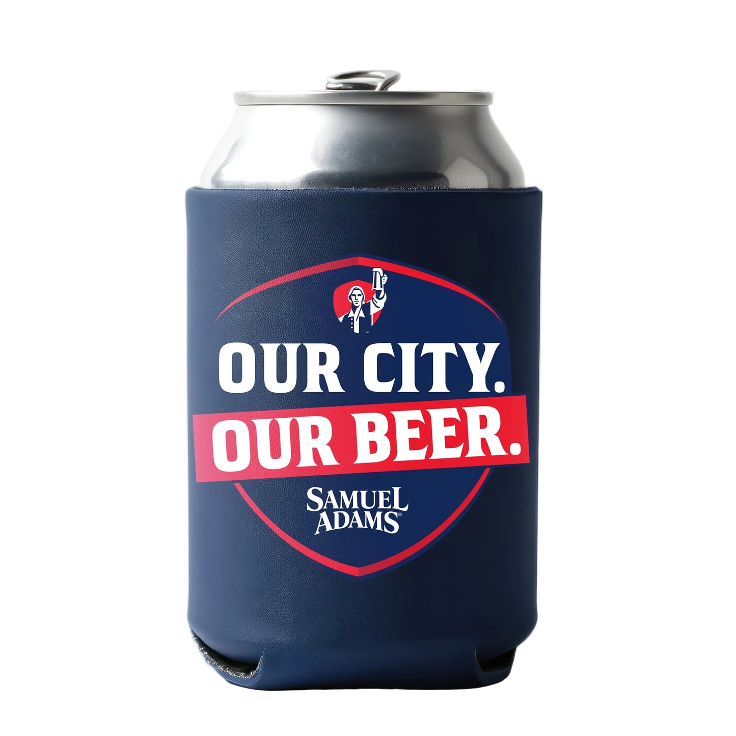 A silver can inside a navy can cooler printed with a shield-shaped Samuel Adams graphic and bold text reading “OUR CITY. OUR BEER.” in white and red against a blue background