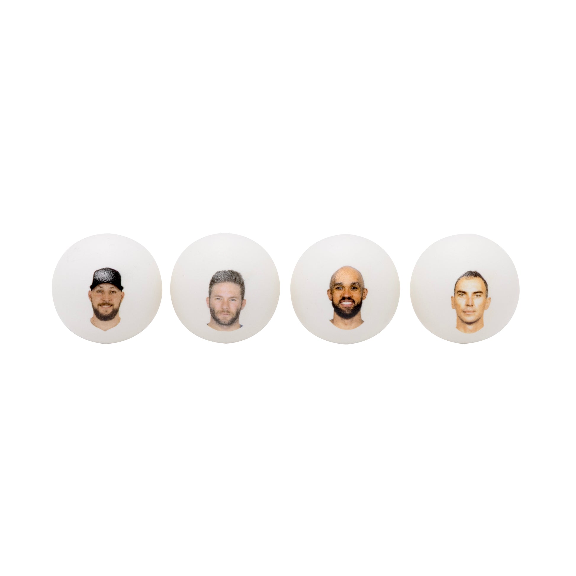 Four white ping pong balls with headshots .