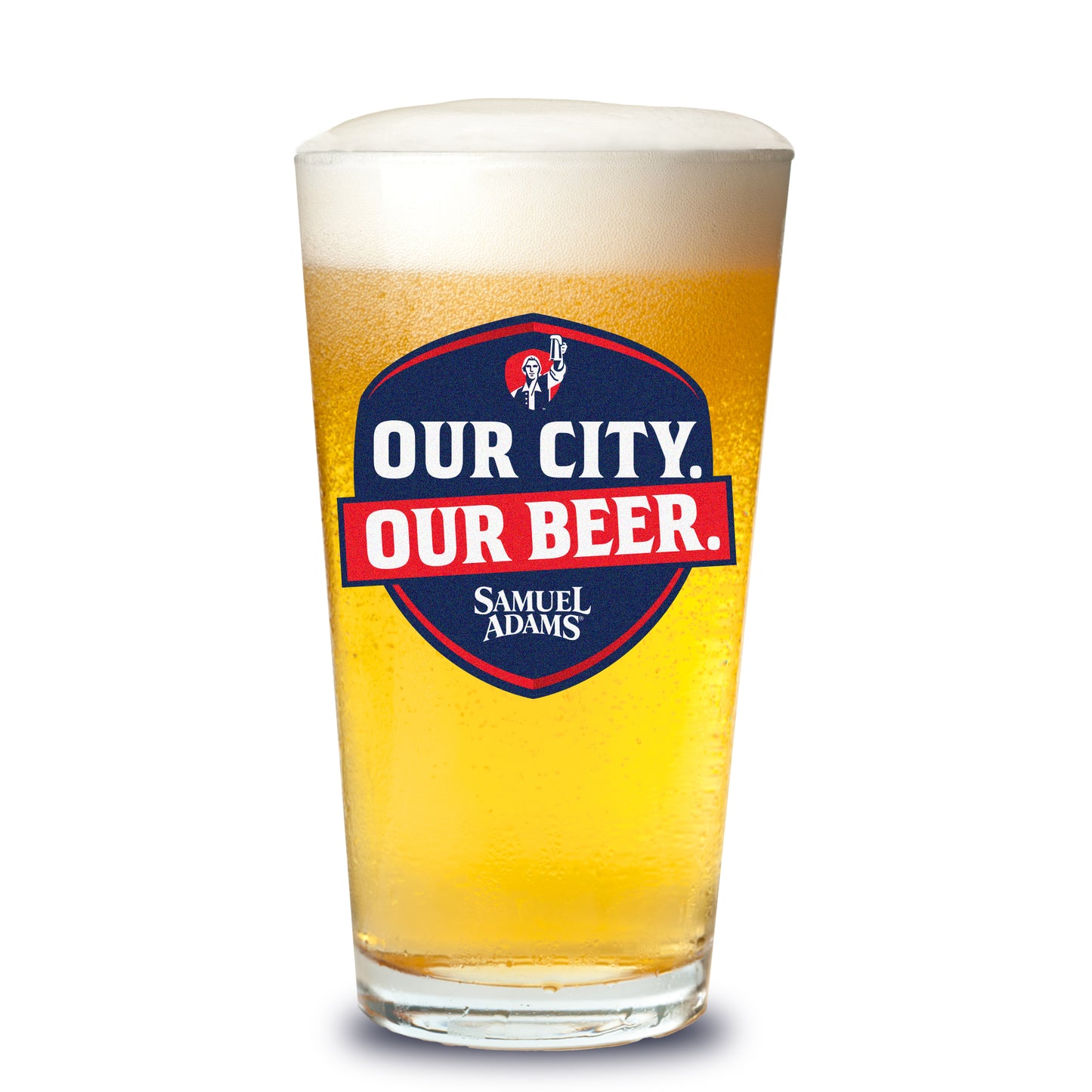 A Samuel Adams pint glass filled with golden beer showing the navy‑and‑red “OUR CITY. OUR BEER.” shield logo with the Samuel Adams icon and wordmark.