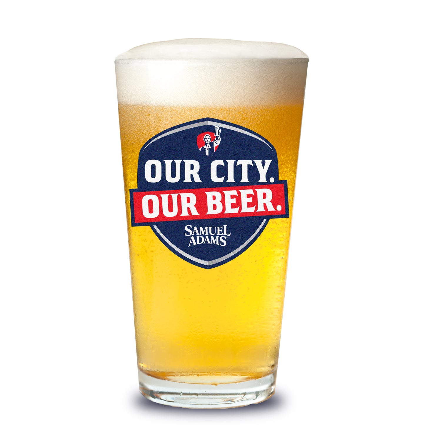 A Samuel Adams pint glass filled with golden beer showing the navy‑and‑red “OUR CITY. OUR BEER.” shield logo with the Samuel Adams icon and wordmark.