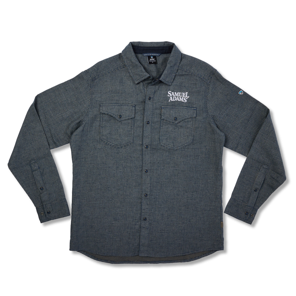A dark gray long-sleeve button-up shirt with a subtle grid pattern, featuring two chest flap pockets and a white embroidered 'Samuel Adams' logo on the left chest, displayed on a clean white background.