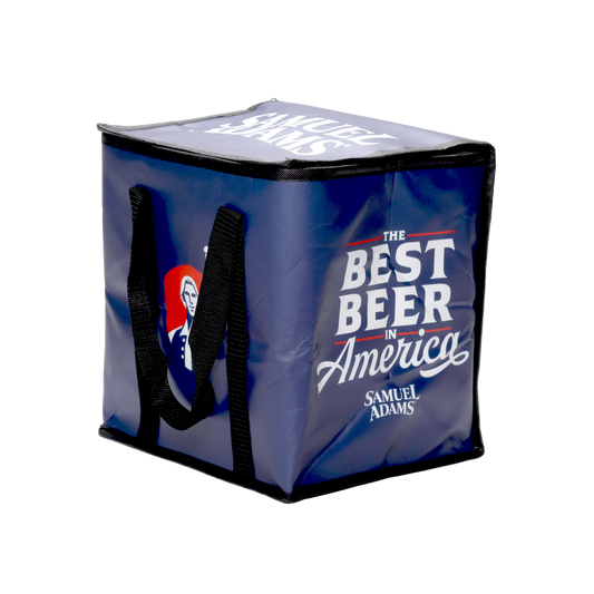 A navy Sam Adams-themed Cooler Bag. Has black handles, the Sam Adams hoist logo, and the slogan "the best beer in America".