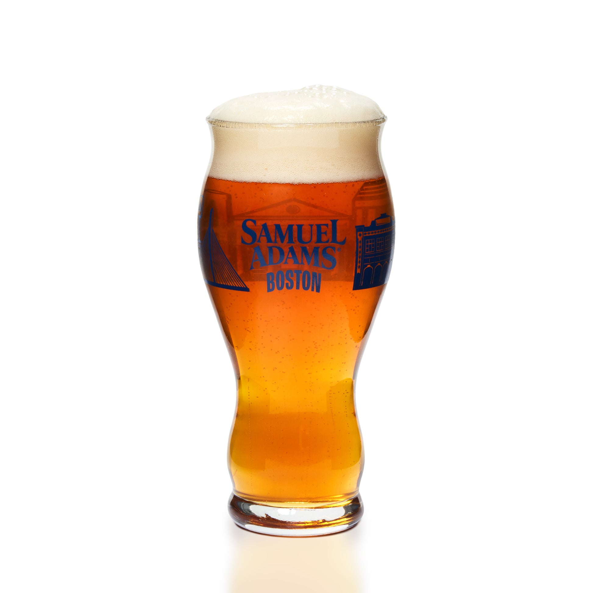 A Samuel Adams Boston beer glass filled with amber beer and topped with white foam, centered on a clean white background.