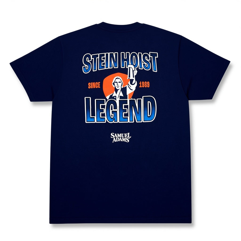 A navy blue short-sleeve t-shirt shown from the back, featuring a graphic print with the text 'STEIN HOIST LEGEND', 'SINCE 1969', an illustration of a suited figure, and 'SAMUEL ADAMS' below.