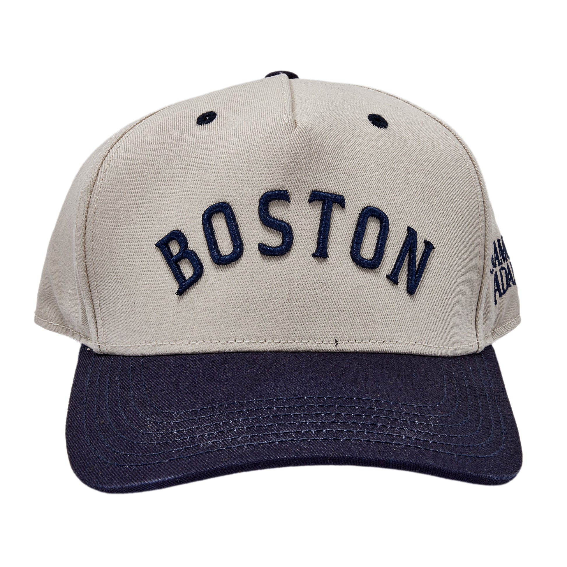 Two tone hat, white cap and navy brim. Raised embroidered Boston text across front.