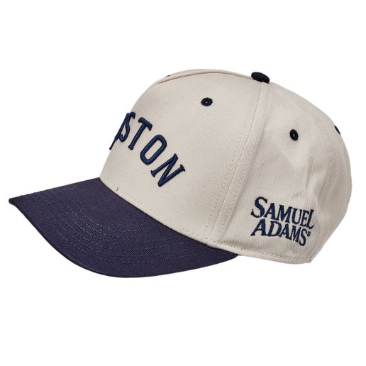 Two tone hat, white cap and navy brim. Raised embroidered Boston text across front.