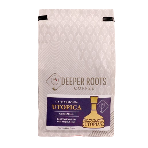 Utopias coffee beans packaged in white and grey packaging.