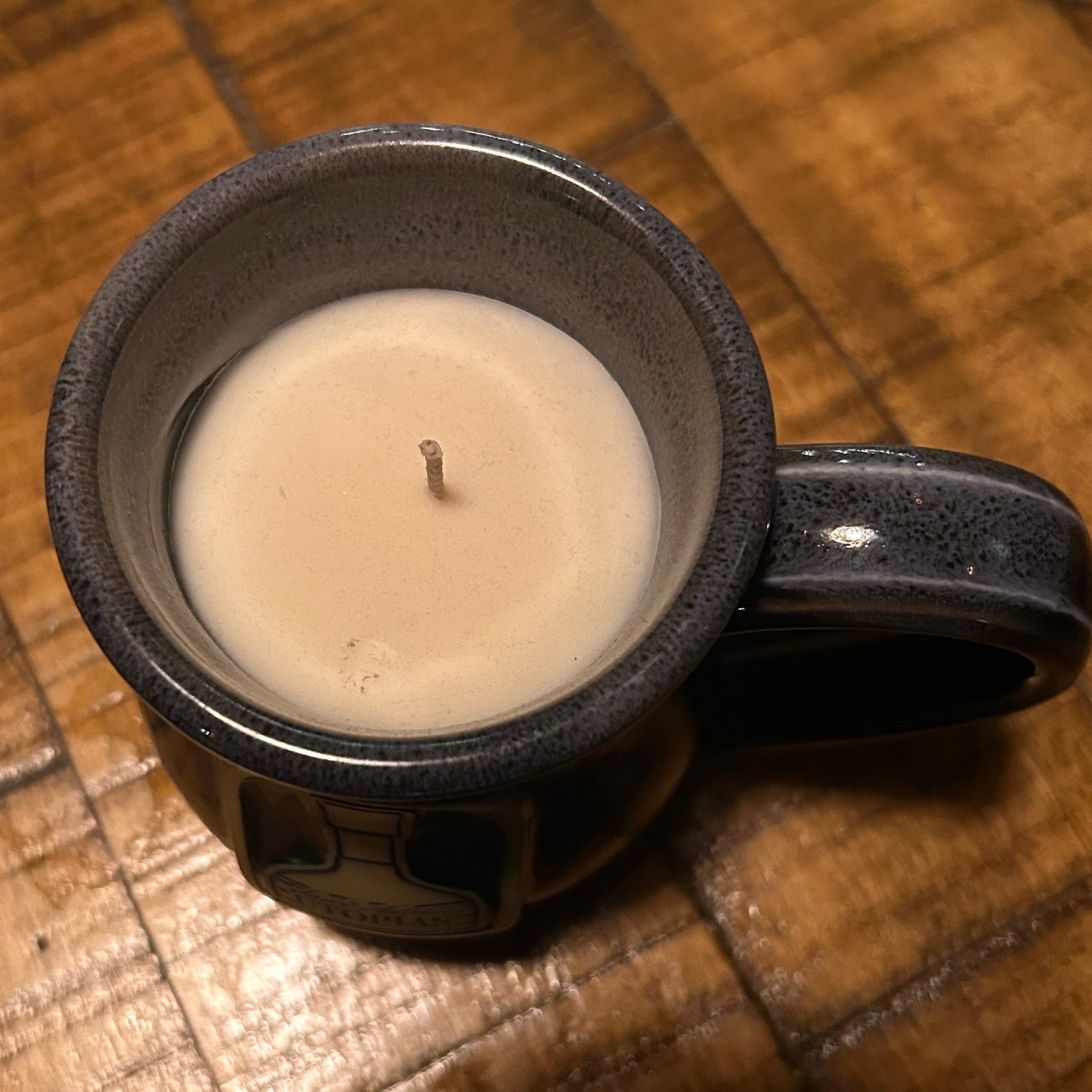 Utopias ceramic mug candle with a sam adams utopias designed on it. 