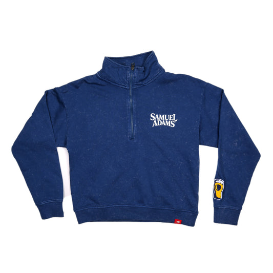 Front view of a vintage blue women’s quarter-zip sweatshirt featuring the Samuel Adams logo on the left chest and a pint glass patch on the right sleeve.