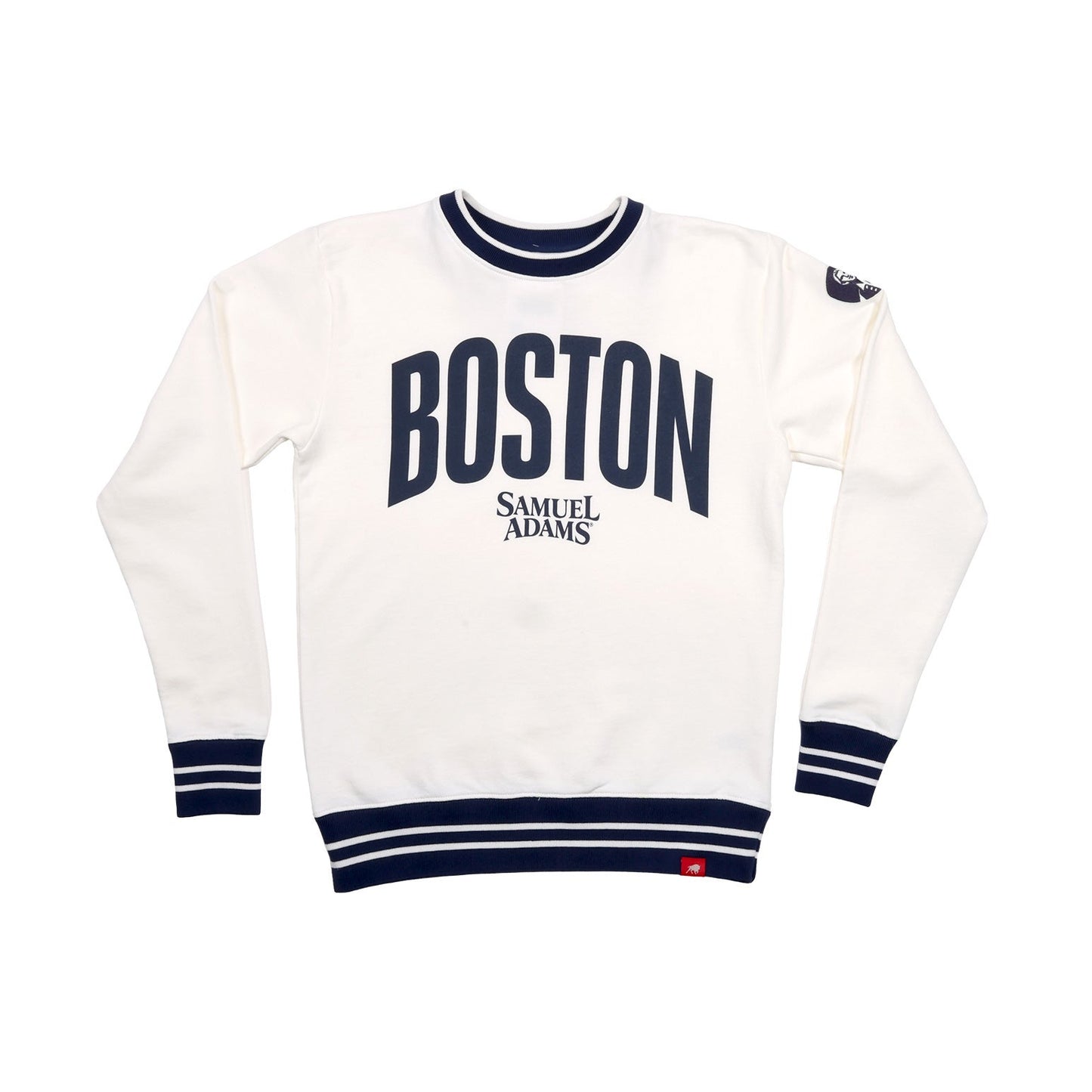 This is a white crewneck sweater with thick navy stripes around the neckband, cuff, and hem of the sweater. In matching large navy text reads "BOSTON", beneath in smaller text in the Samuel Adam's logo.